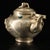 A charming Chinese silvered-bronze teapot with an arched overhead handle, modeled after the classical scholar's wine ewer...