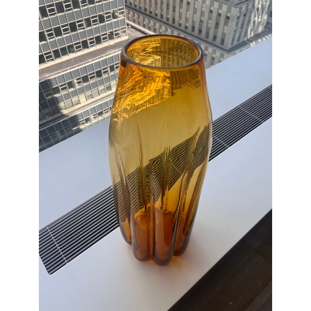 Extra large hand blown "floor vase" designed by Don Shepherd for Blenko Glass. This is an amber shade with fluted tapered...