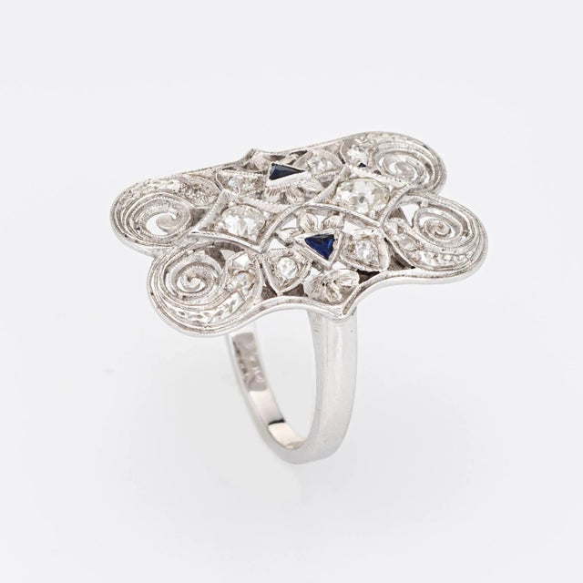 Finely detailed vintage Art Deco era diamond & sapphire ring (circa 1920s to 1930s) crafted in 14k white gold. Two old...