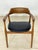 For sale is an elegant armchair in a trendy retro design, crafted from high-quality walnut with an easy-care black faux...