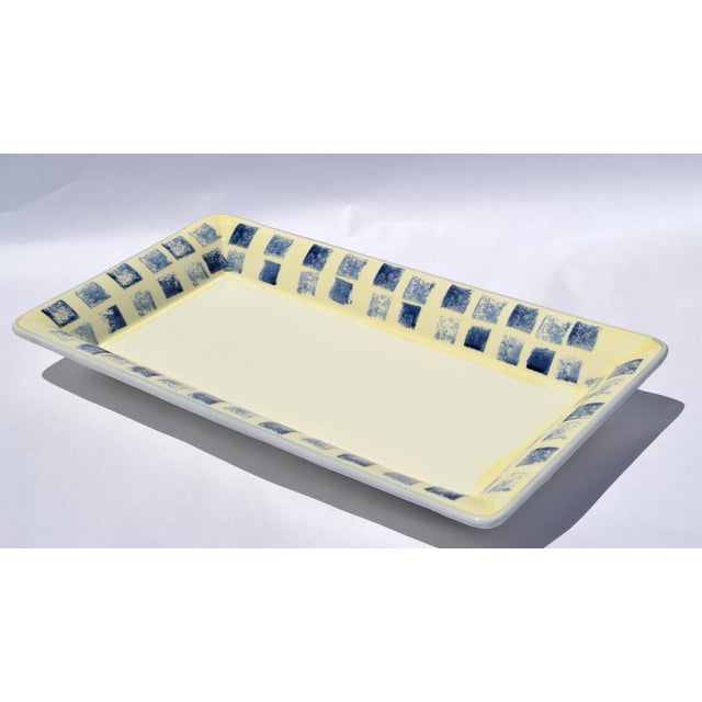 The Dansk Made in Italy rectangular platter is a vintage, handcrafted ceramic serving piece featuring vibrant cobalt blue...