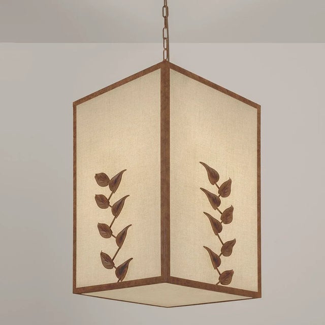 An Elegant Large Pendant With A Hand Finished Rust Patina Frame And Random Climbing Metal Leaves On Each Side. The Frame...