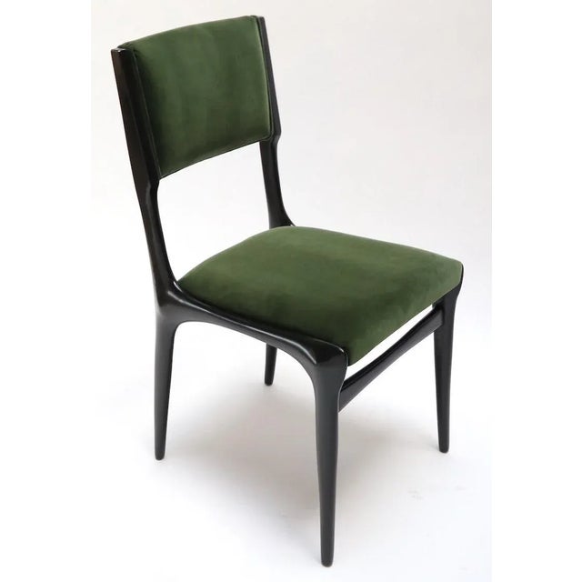 Set of 10 beautifully sculpted Carlo de Carli dining chairs, newly restored and upholstered in green Belgian velvet. Note...