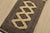 A tribal Bokhara Jaldar rug hand-knotted with fine wool on a cotton foundation. This rug features geometric medallions set...