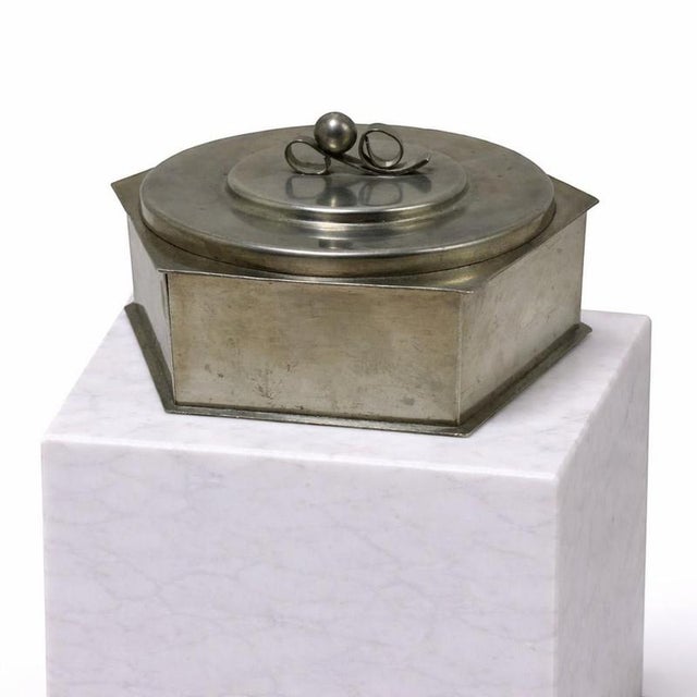 A refined and rare pewter lidded box by Svenskt Tenn, dated 1936, exemplifying the elegance and craftsmanship of early...