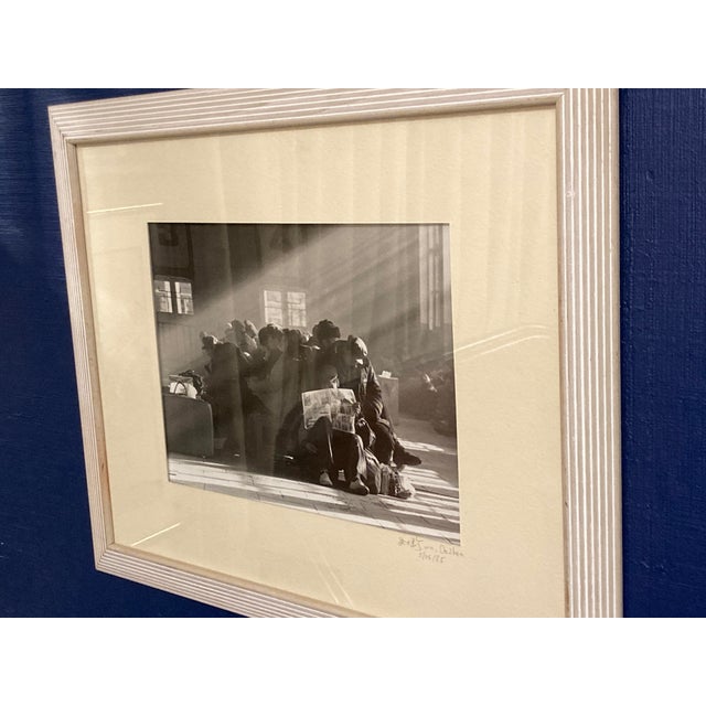 Wonderful depiction of a hazy train station full of tired travelers captured through the lens by renowned photographer...