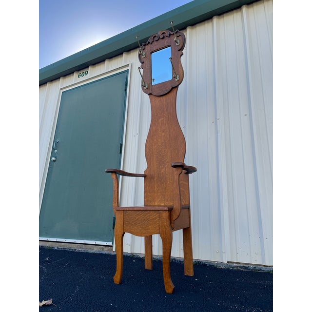 A narrow antique oak hall seat made of beautifully grained oak wood. Simple and primitive, yet elegant and timeless. Four...