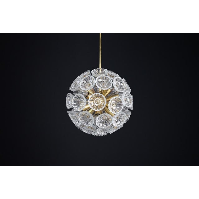 Mid-Century Modern Floral Glass and Brass Chandelier, Germany, 1960s This beautiful mid-century modern chandelier from...