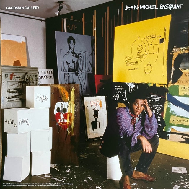 Elevate your space with this striking exhibition poster featuring Jean-Michel Basquiat in his Great Jones Street studio,...
