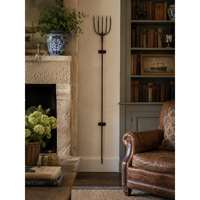 A striking early 20th century hand-forged iron harpoon with a wonderfully lean, sculptural silhouette and naturally...