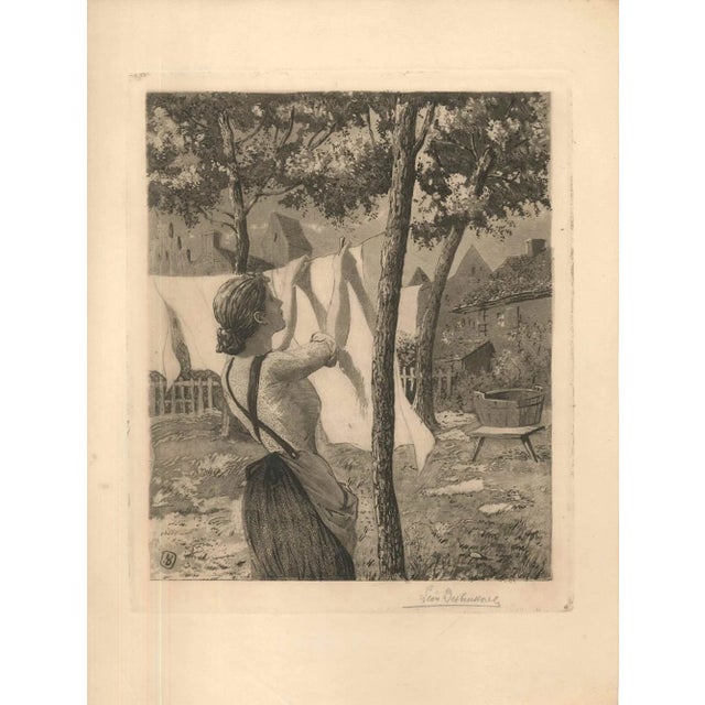 Woman Hanging Laudry is a beautiful black and white aquatint and etching on ivory-colored paper, realized in 1904 by the...