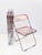 Set of 4 original and signed "plia" pink acrylic glass folding chairs. Nos (new old stock) this fantastic set was designed...