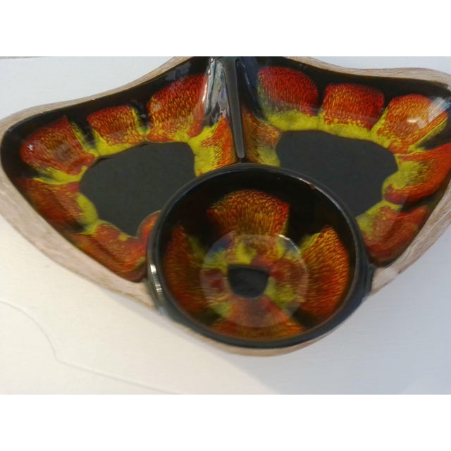 Cool mid-century divided bowl in California Pottery's "Sequoia Ware" pattern. Vibrant red, orange and yellows on black...