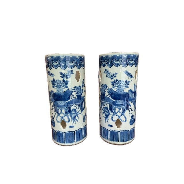A distinguished pair of 19th century Chinese blue and white porcelain hat stands, exemplifying the refined aesthetic of...