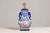 A vintage blue and white porcelain table lamp with colorful hand-painted court scenes on the belly. This vintage blue and...