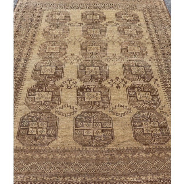 Measures: 7'2 x 9'6. This Turkomen Ersari rug has been hand-knotted in the finest wool. The rug features an all-over...