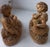 Decorative pair of figurines depicting pastoral/devotional shepherd children in reclining poses, richly modelled with...