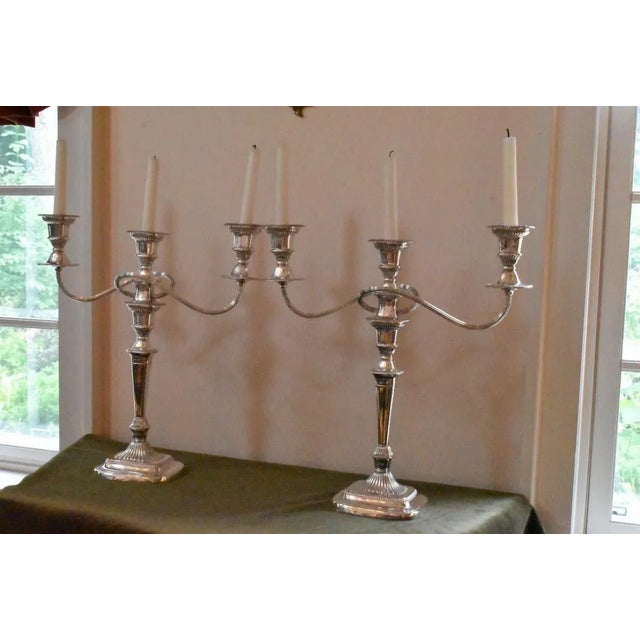 Pair of Sheffield candelabra in late Georgian form full of artful design and fine workmanship. In brilliant silver plate....