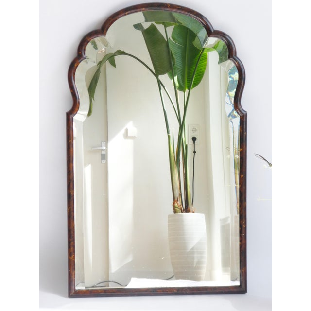 Antique large wooden scalloped mirror from the 19th century in a large size with beveled glass. The mirror has a nice...