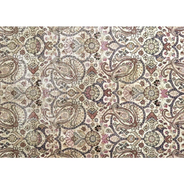 1940s Persian Tabriz Rug. Hand woven in the Tabriz region of Northern Iran. Distressed and refinished in the U.S. The...