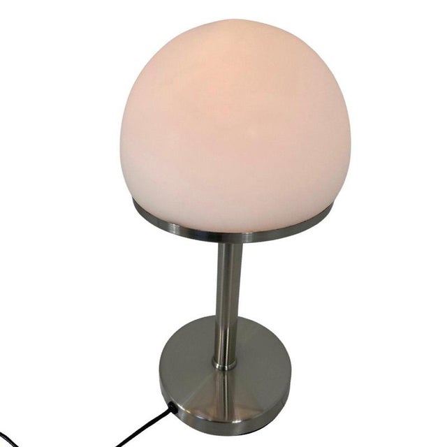Bauhaus style table lamp with an opaline top. Attributed to Wagenfeld/Tecnolumen but as this piece has no markings we can...