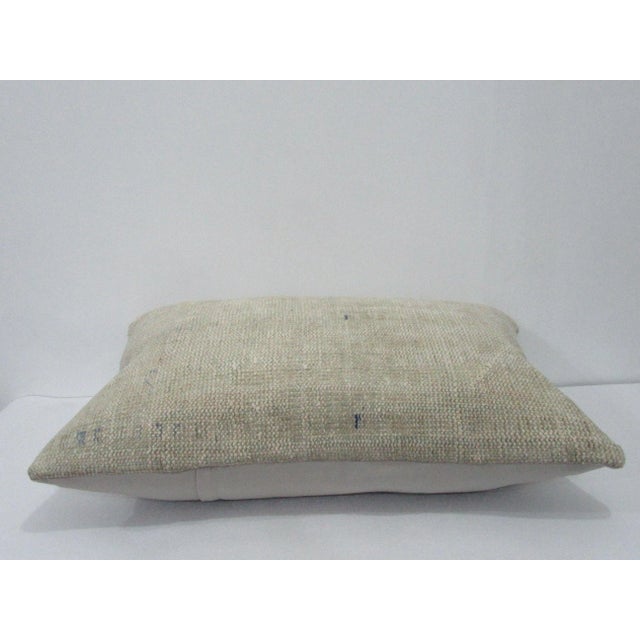 Decorative pillow cover made from a vintage Turkish handknotted rug. Backed with good quality cotton fabric. Pillow...