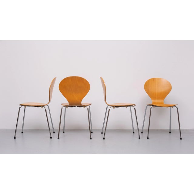Very nice set of 4 Beech Plywood Rondo dining chairs. Chrome legs. Made in Denmark. 1990s. Stackable.