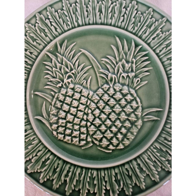 Enhance your table with the timeless charm of this Vintage Bordallo Pinheiro Green Pineapple Majolica Salad Plates Set....