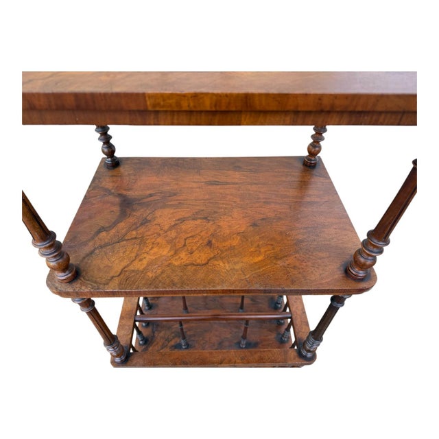 This is a 19th century Edwardian carved rosewood music stand or etagere. The spindles are carved rosewood. The piece has a...