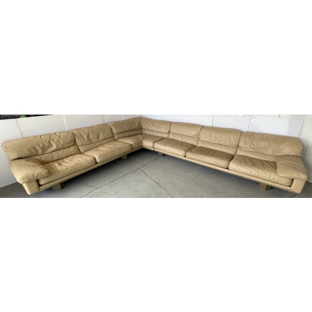 Huge 1980s Italian leather three pieces sectional sofa with triangular feet in tan leather from the "Collezione Poltrone"...