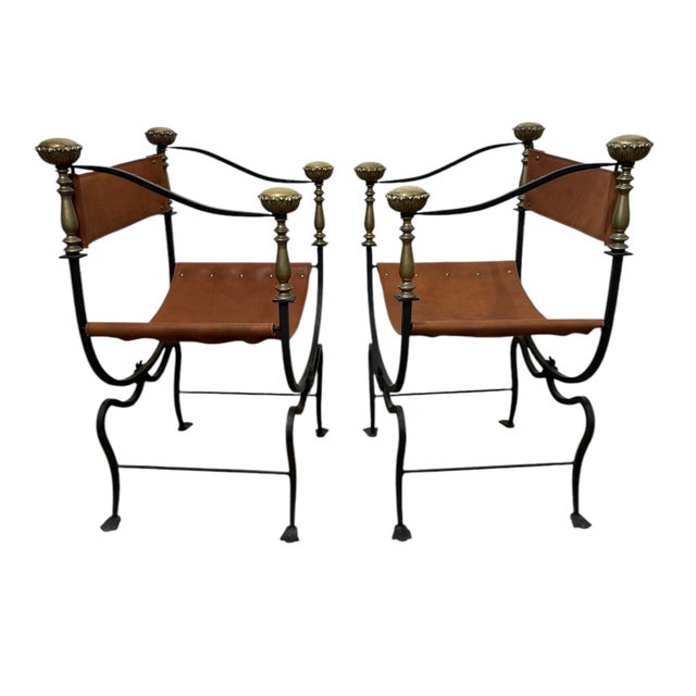 A handsome pair of Italian iron, brass, and leather Savonarola style Dante chairs made in the 1920s. These well designed...