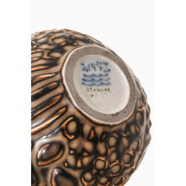 This rare ceramic vase, designed by Axel Salto and produced by Royal Copenhagen in Denmark, is a distinguished example of...