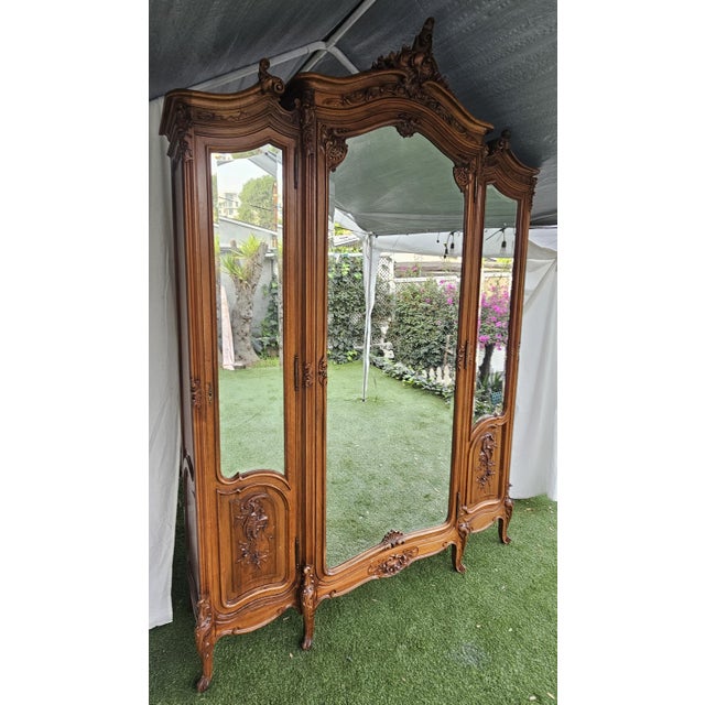 Antique , French, 3 door Armoire Louis XV Style Grand Louis XV style armoire. Handcrafted from solid Walnut wood with...