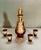 An early 20th century bohemian glass liqueur set consisting of a decanter and four small glasses made of a vibrant red...