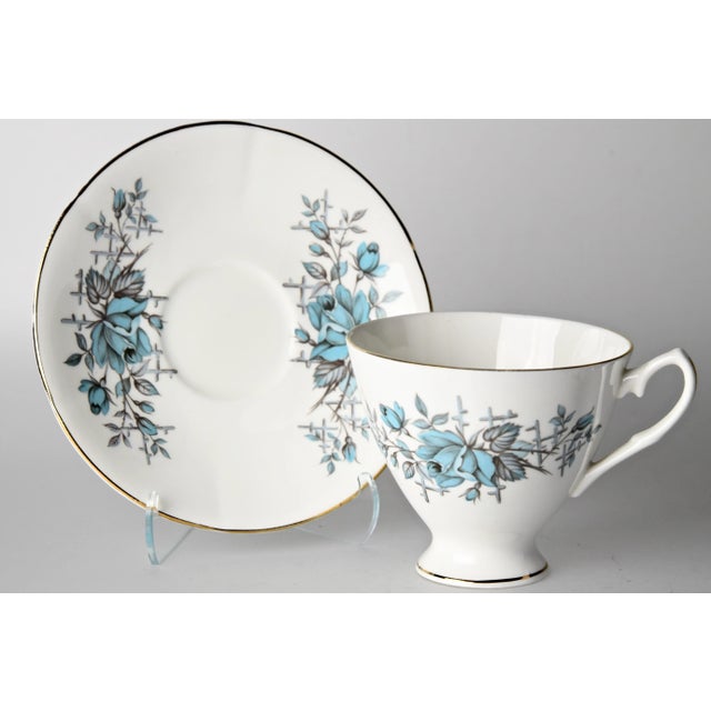 Assortment set of six stylish midcentury English porcelain cups and saucers, each embellished with motifs of lush roses...