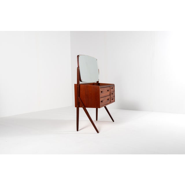 Beautiful Danish mid century modern vanity table from the 1960s. Made of warm teak wood with a rich natural grain and...