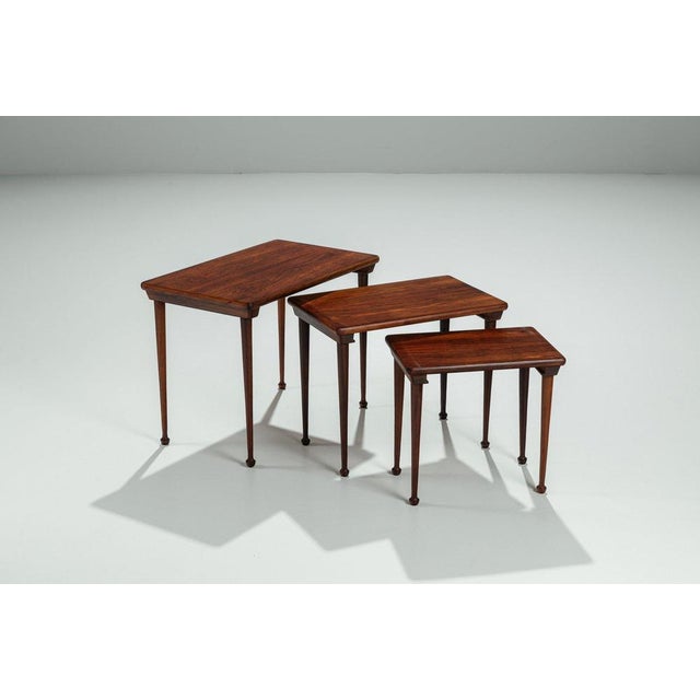 Elegant set of Danish nesting tables produced in Denmark in the 1960s. The set is crafted in beautifully grained rosewood....