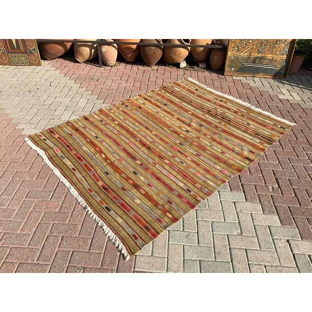 This beautiful, vintage, handwoven Kilim is approximately 60 years old. It is handmade of very fine quality, hand-spun...