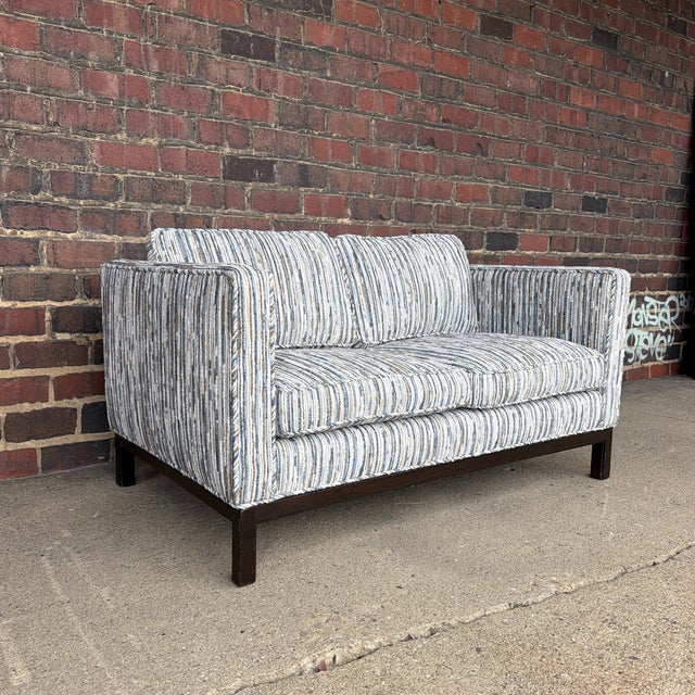 A beautifully preserved Edward Wormley for Dunbar Mid-Century Modern loveseat, showcasing the understated elegance and...