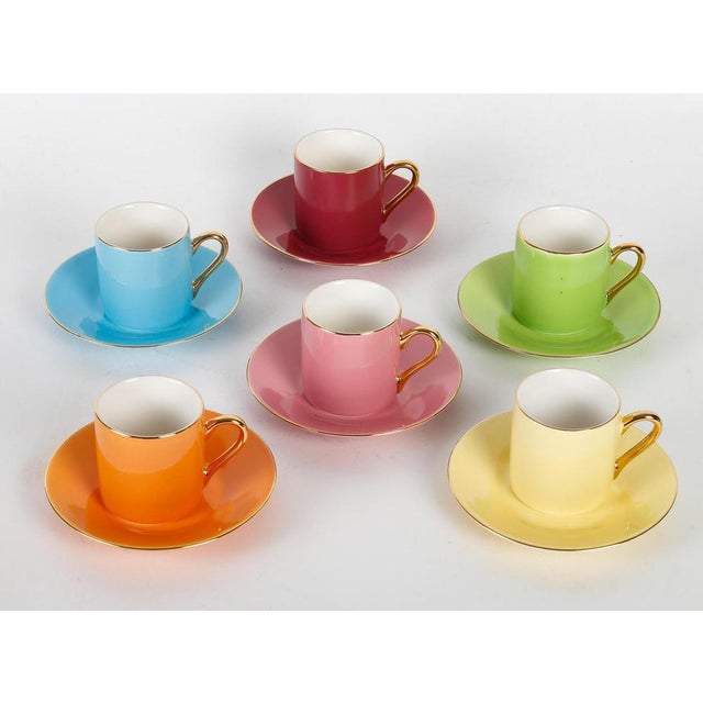 Set of six fine porcelain cups and saucers in their box, in spring colours. Box: h: 7cm, w: 27cm, d: 25,5cm