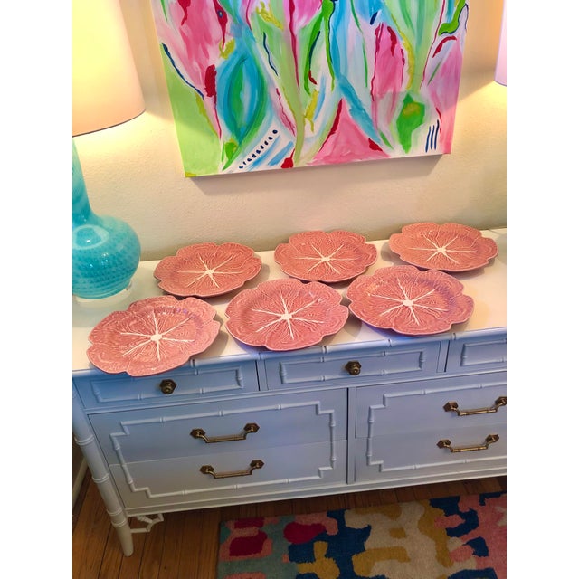 Set of six pink Bordallo Pinheiro chargers with scalloped edges. No chips or cracks. 12”