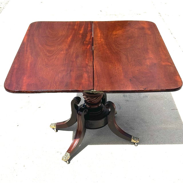 Antique Flame Mahogany, Regency-Style, Flip-Top, Rotating, Game Table, W/Hidden Drawer, Carved Pedestal, Brass Claws and Casters. C1810 to 1820 For Sale - Image 4 of 12
