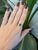 A 1.92ct tsavorite oval ring set in solid 14K yellow gold, set with twenty-four earth mined diamonds. Tsavorite is a rare...