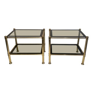 1970s Pair of brass side tables with smoked glass shelves For Sale