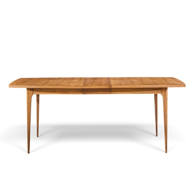 Broyhill Brasilia Mid Century Walnut Expanding Dining Table with 1 Leaf This table measures: 66.25 wide x 40 deep x 30...