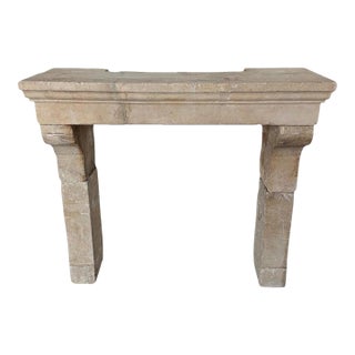 Petite 18th Century French Limestone Fireplace Mantel With Scrolled Corbels For Sale
