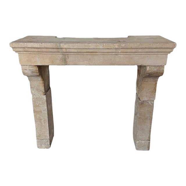 Petite 18th Century French Limestone Fireplace Mantel With Scrolled Corbels For Sale