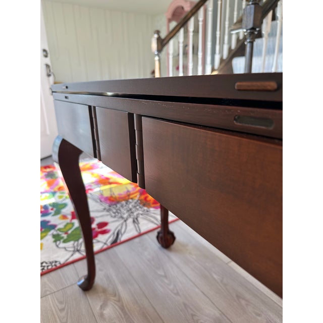 Add timeless elegance and incredible versatility to your home with this stunning Kindel Mahogany Flip-Top Table....