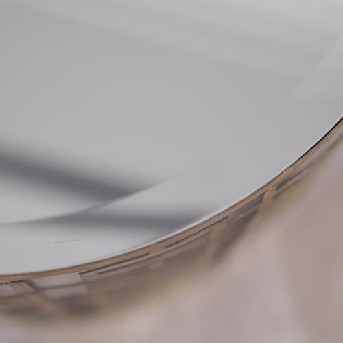 Stylish gold side table with a cylindrical metal frame and a mirrored glass top. The openwork geometric structure creates...