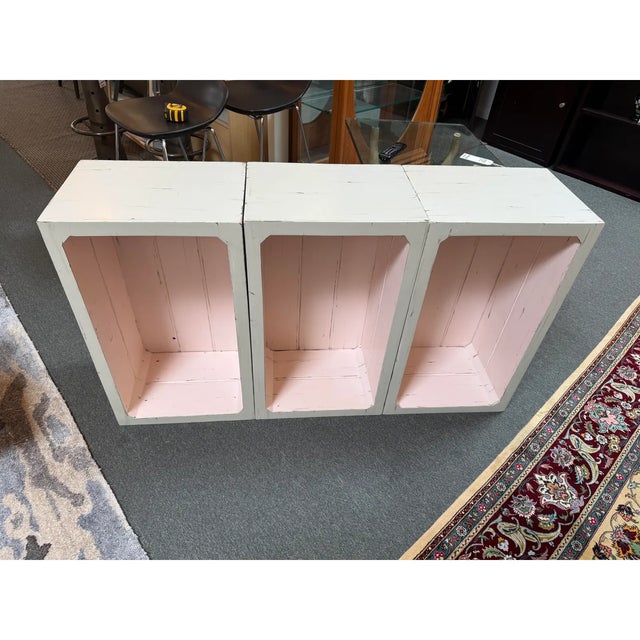 Design Plus Gallery presents a Set of Three Blush Pink + White Stacking Shelves. The open cubbies can be used alone of...